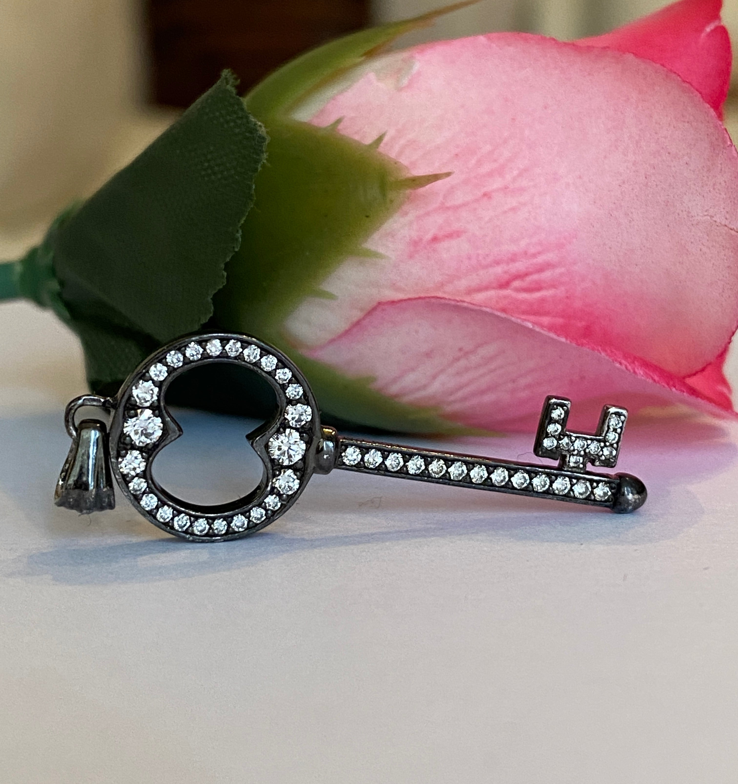 Black rhodium-plated solid 18 kt gold diamond key pendant