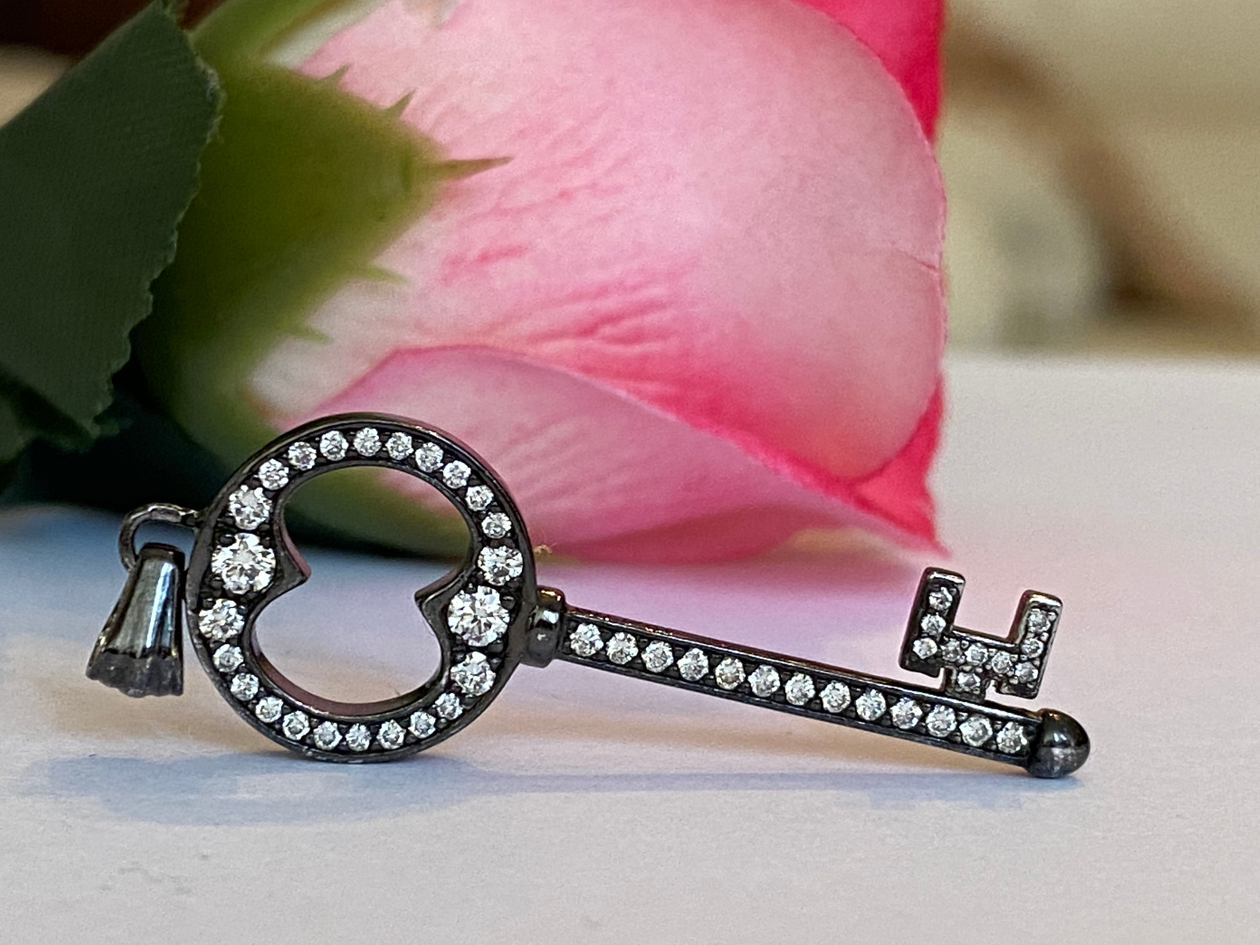 Black rhodium-plated solid 18 kt gold diamond key pendant