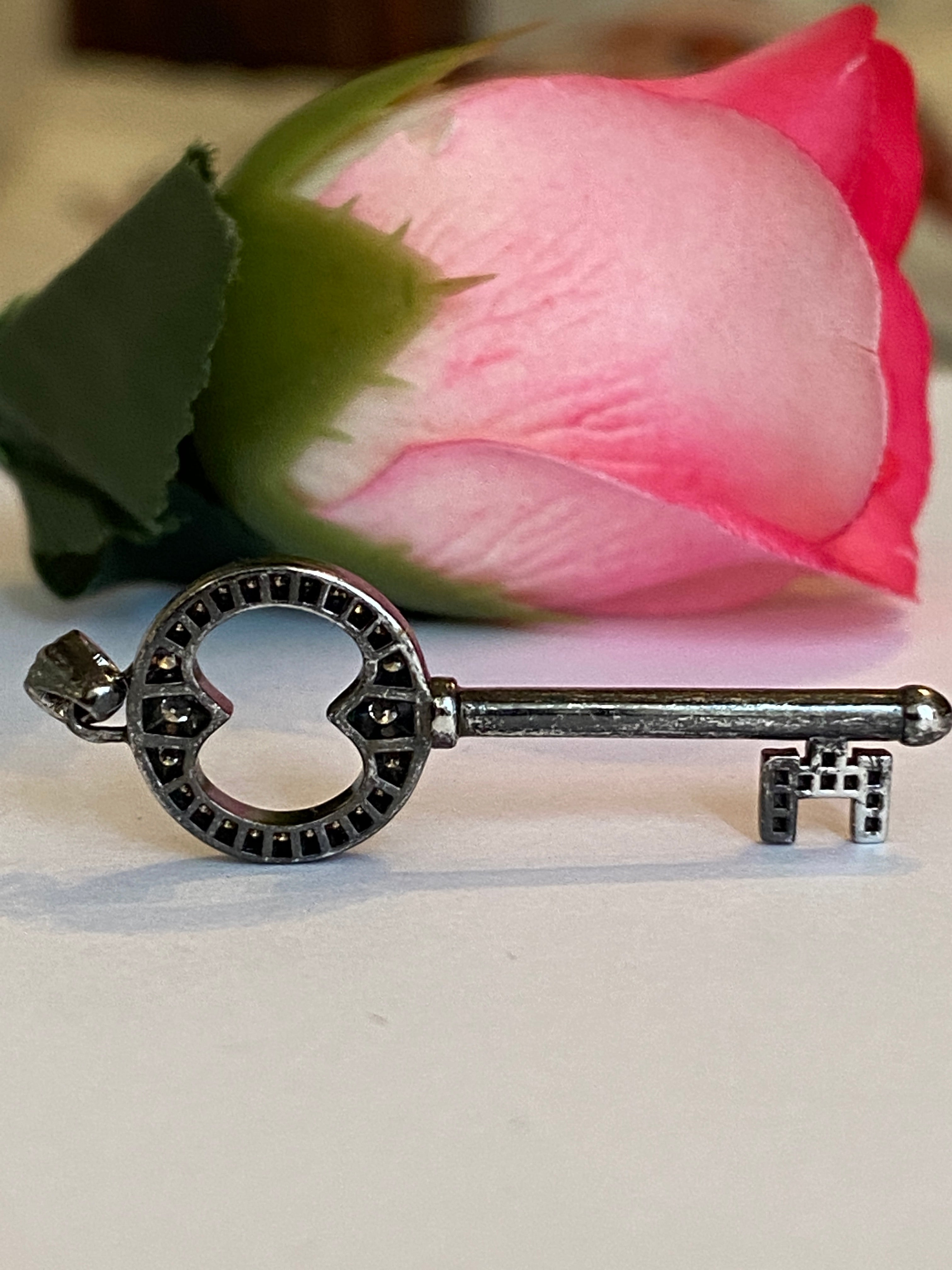Black rhodium-plated solid 18 kt gold diamond key pendant