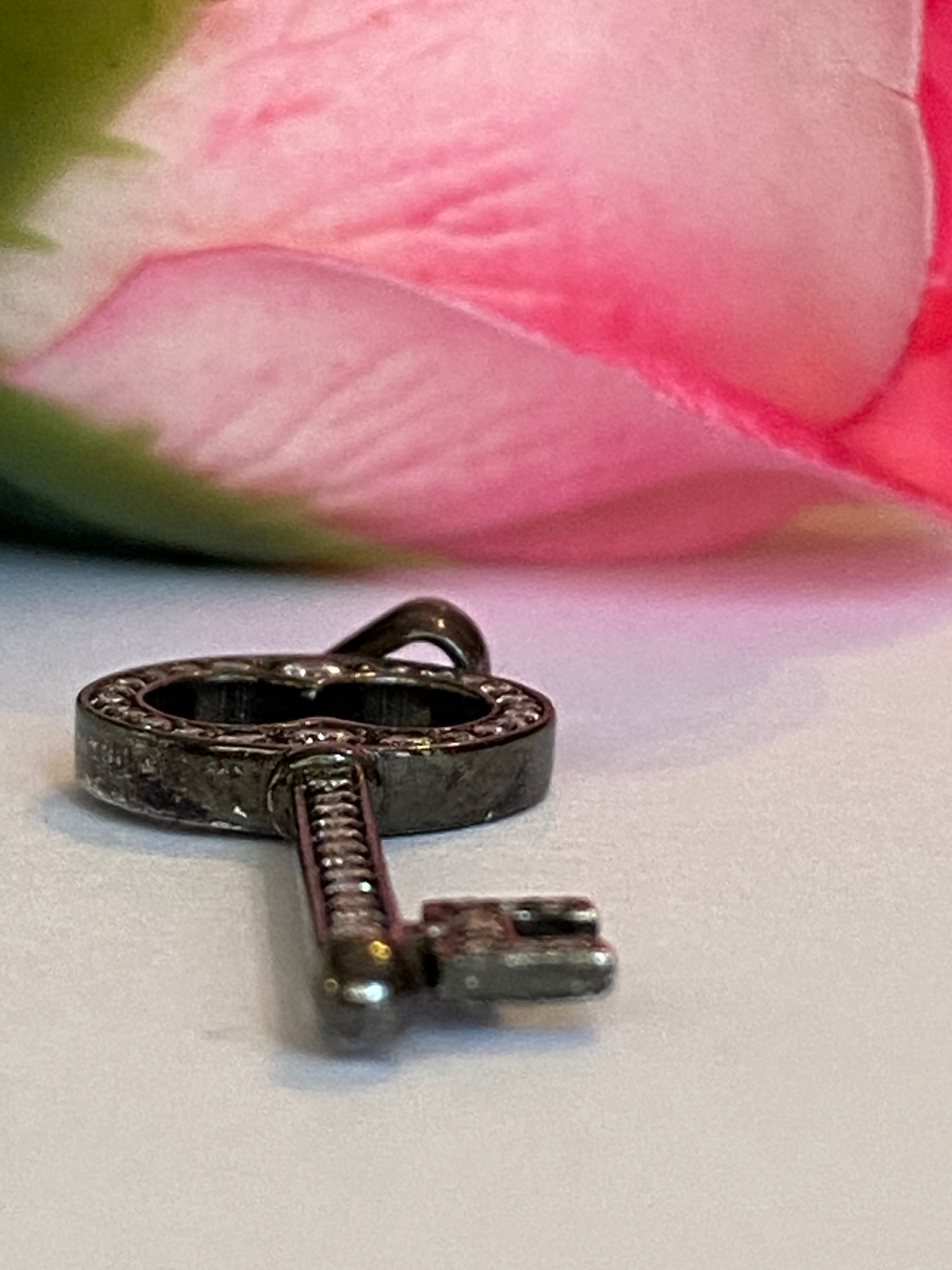 Black rhodium-plated solid 18 kt gold diamond key pendant