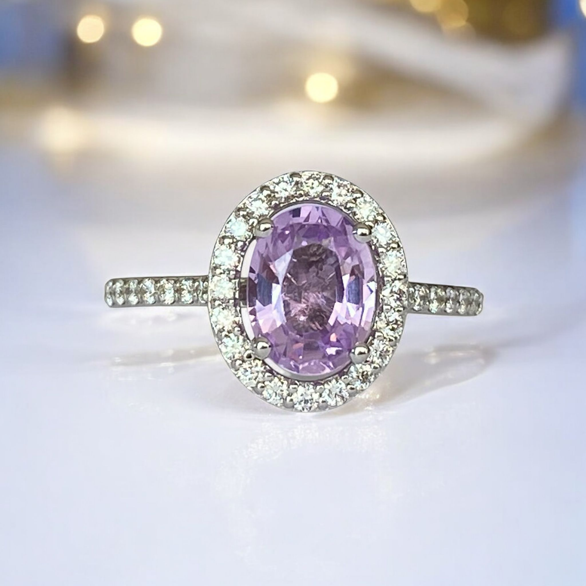 Exquisite Unheated Pink-Purple Sapphire Halo Ring in 18 kt white gold