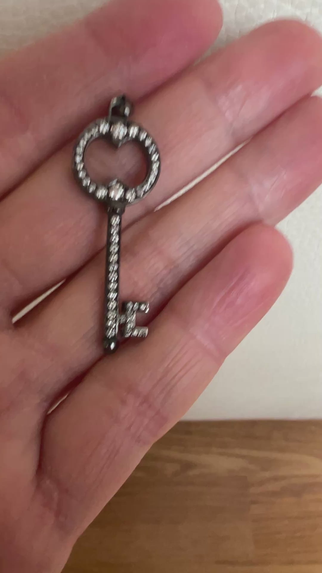 Black rhodium-plated solid 18 kt gold diamond key pendant